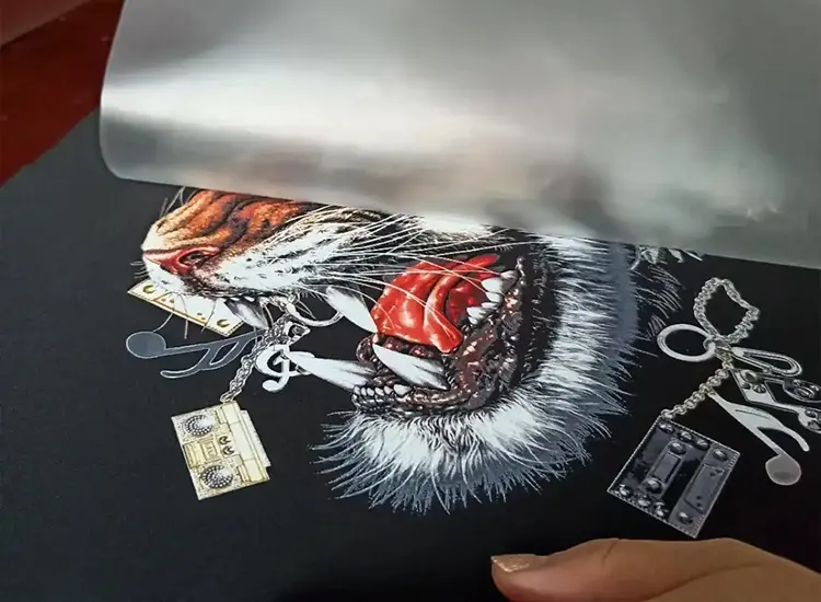Tiger graphic being transferred onto black fabric