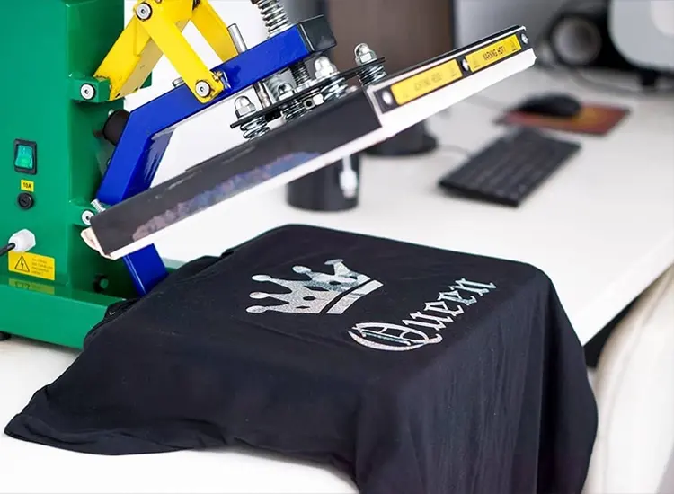Heat press above a printed black shirt