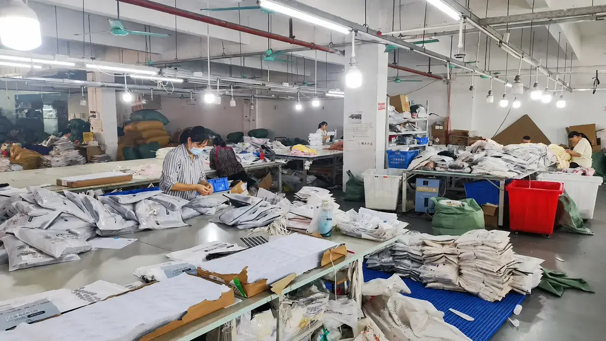 Final inspection, packing, and shipping preparation for custom tracksuits