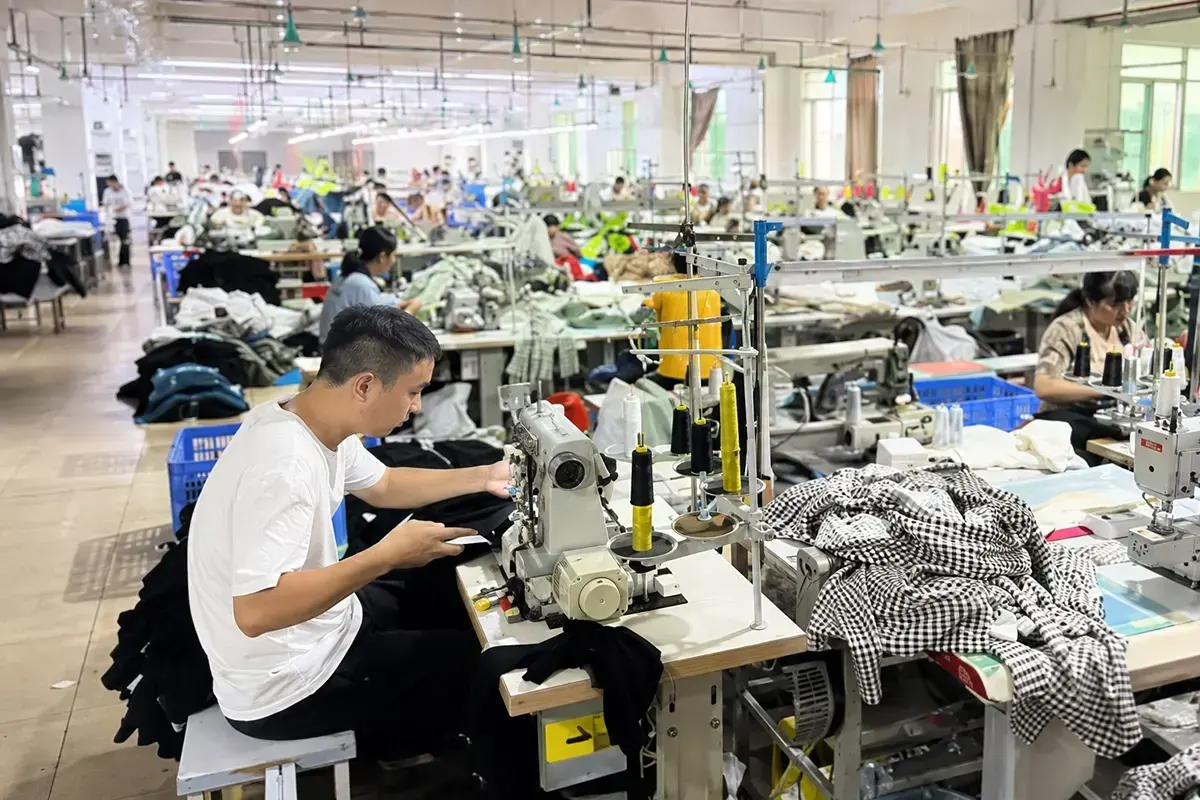 Cutting, sewing, and finishing during custom dress bulk production