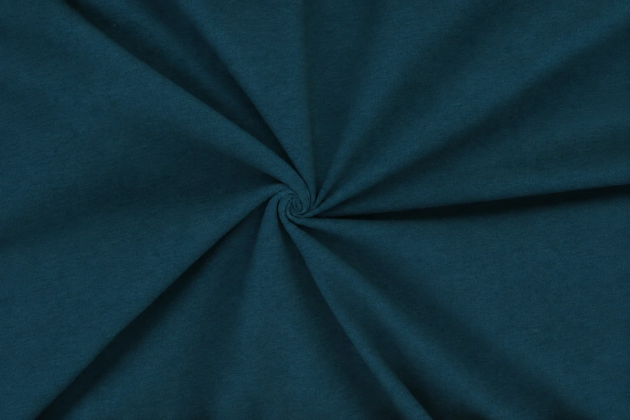 Dark teal jersey fabric gathered into soft folds with a fine knit texture