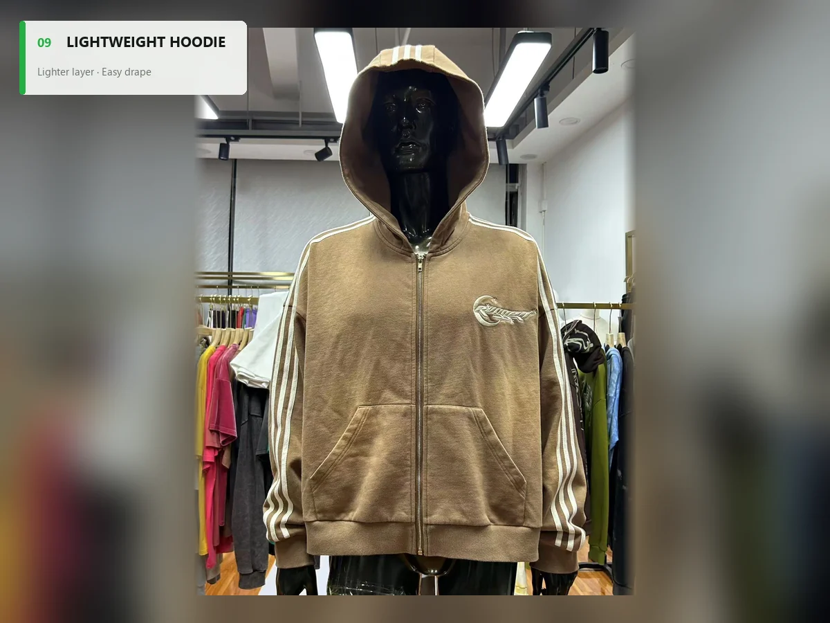 Tan lightweight full-zip hoodie with a relaxed drape and striped sleeves
