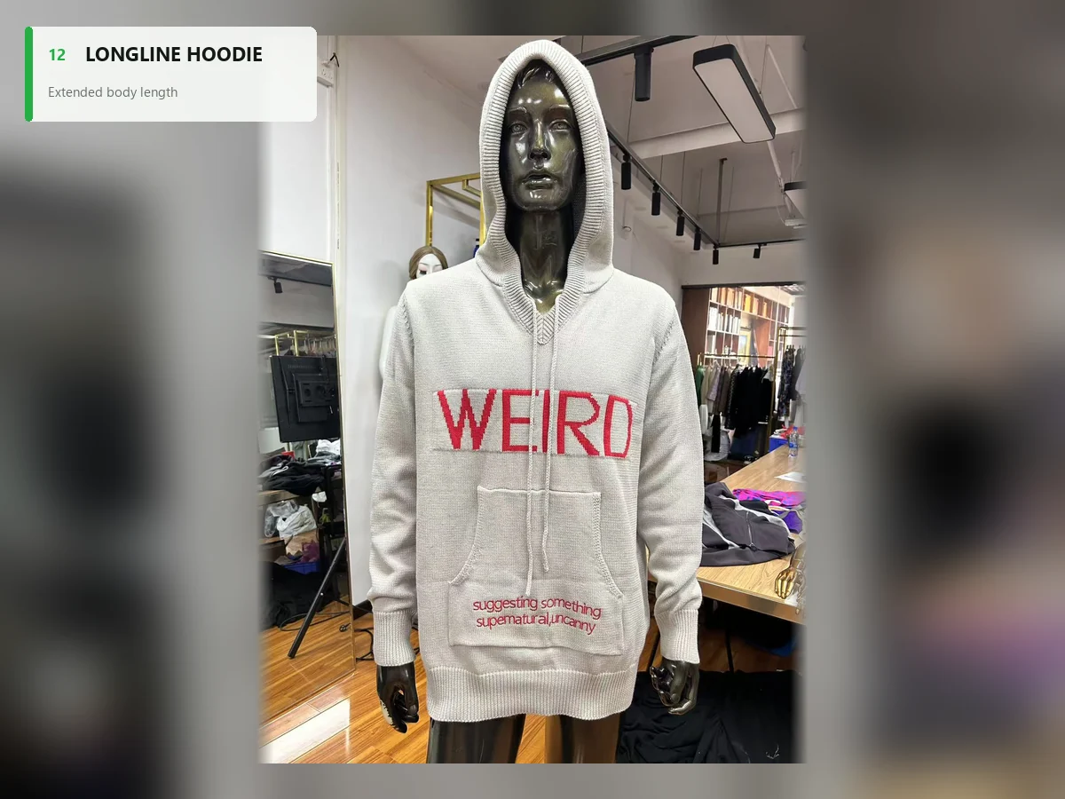 Light gray knitted longline hoodie with an extended body and large front pocket