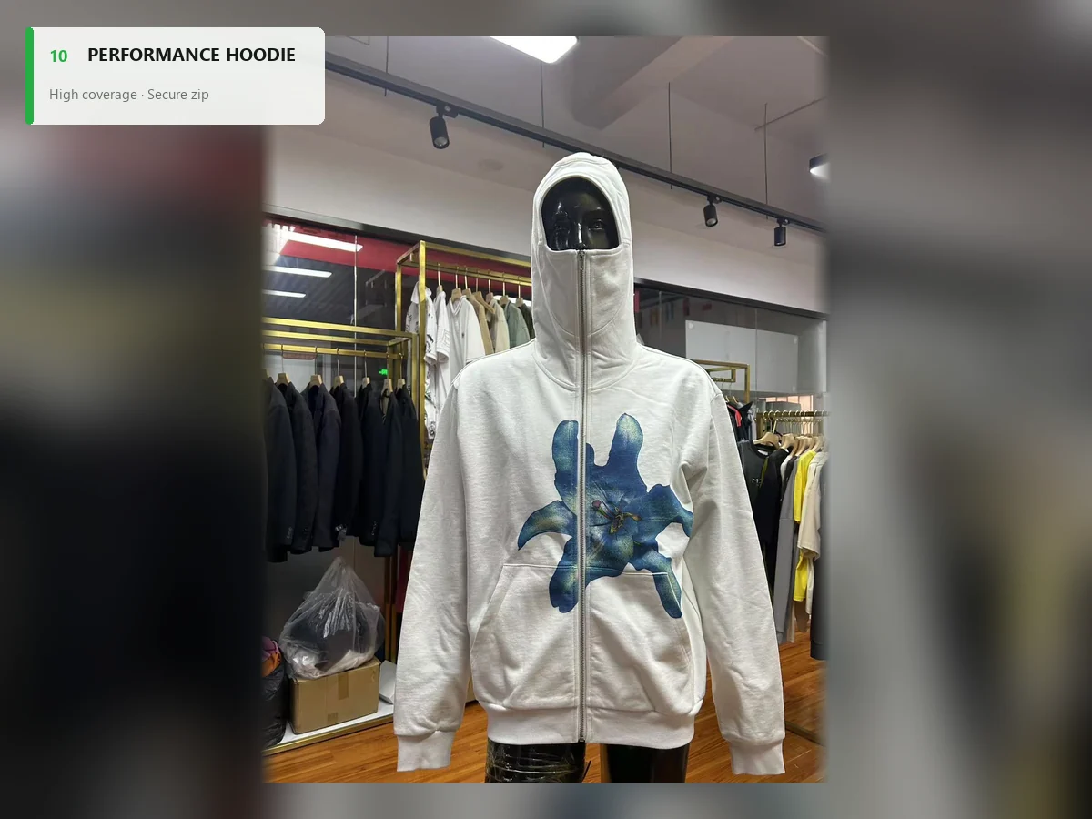 White performance-inspired zip hoodie with a high-coverage hood and front graphic