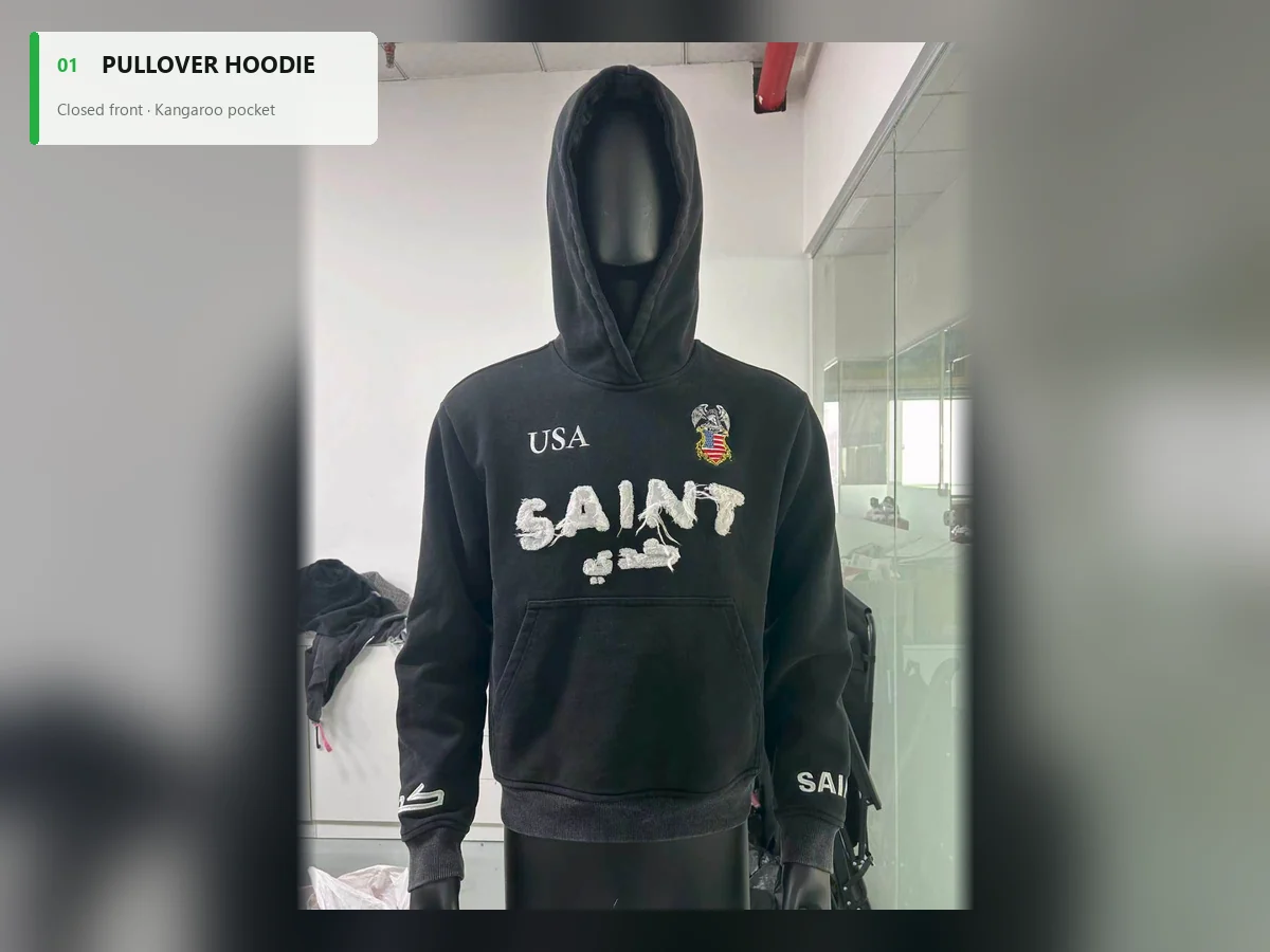 Black pullover hoodie with appliqué artwork and a kangaroo pocket on a mannequin