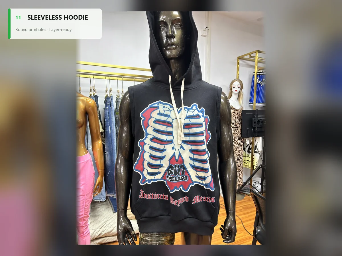Black sleeveless pullover hoodie with bound armholes and a rib-cage graphic